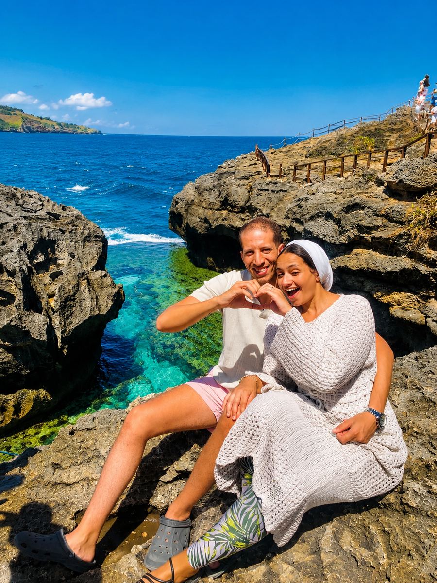 Couple enjoying the turquoise natural pool at Angel's Billabong, Nusa Penida