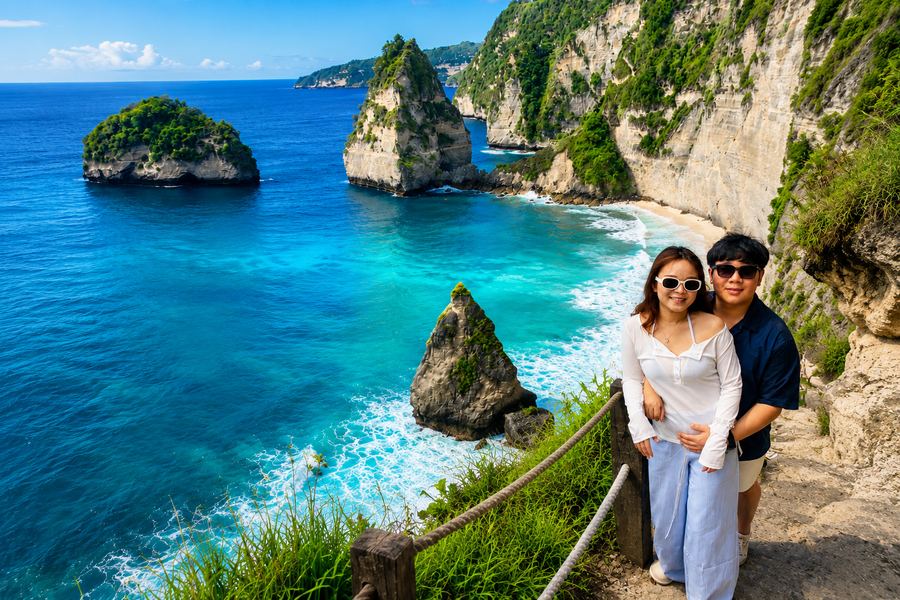 Guests exploring a Nusa Penida viewpoint on a private car charter